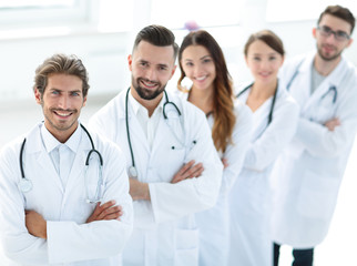 Fototapeta premium Portrait of medical team standing with arms crossed in hospital