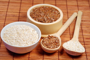 Flax seeds and oat bran on bamboo napkin  