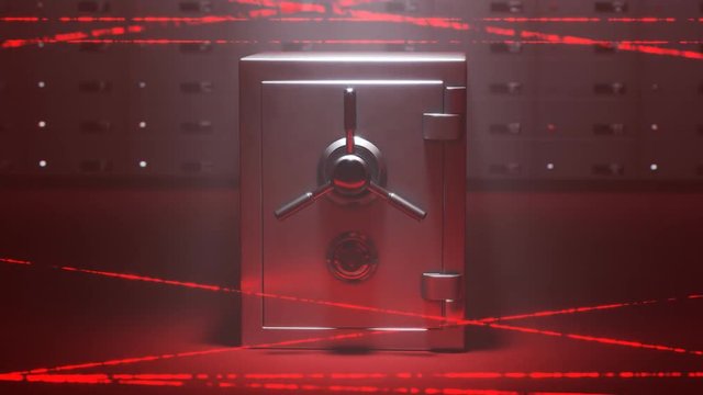 Steel safe and deposit boxes in secured room by red, moving laser system.