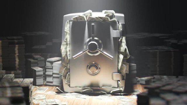 Armored steel safe stuffed with money. Closed safe with stacks of money.