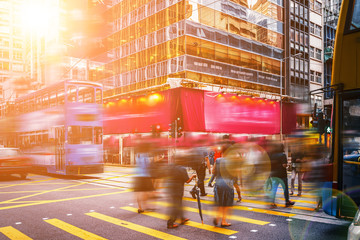 walking people on the busy city street with sunlight effect