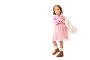 adorable little child in pink clothes and white fur coat isolated on white
