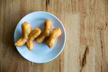 Sweet chinese pastry, puff pastry on white plate, thai breakfast street food traditional gourmet recommended tourist menu