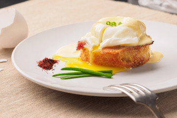 Breakfast is Eggs Benedict - toasted English muffins, bacon, ham, poached eggs, herbs and delicious buttery hollandaise sauce.