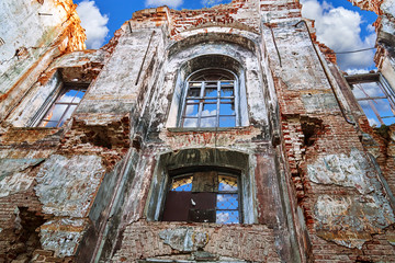 Fototapeta na wymiar Inner wall of an abandoned destroyed roofless church in Russia