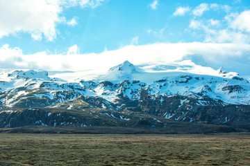 Fototapeta na wymiar Beautiful views of the snow-capped mountains in Iceland.