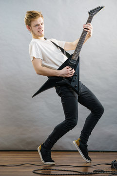 Man playing on electric guitar