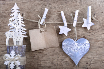 paper sign for message and christmas decoration  hung at a string on wooden background
