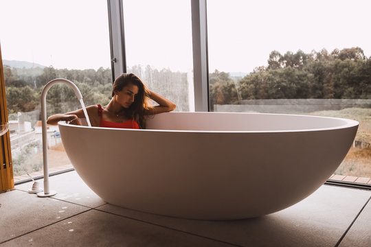 Woman in a modern bath tub
