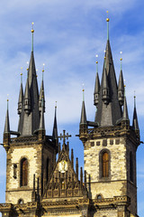 Fototapeta na wymiar Top tower spires of Church of Our Lady before Tyn or Church of Mother of God (Tynsky chram in Czech) in Old Town of Prague, Czech Republic