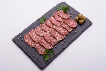 Saucisson sec delicious french salami on a white background