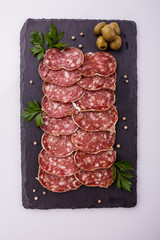 Saucisson sec delicious french salami on a white background