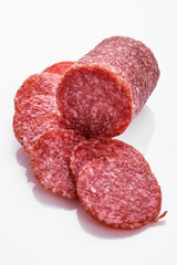 delicious sliced salami on a white background