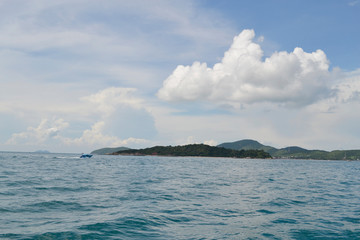 Beautiful sea with quiet sky and mountains in Thailand.