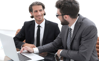Fototapeta premium Two business men working on a laptop