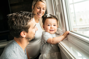 Obraz premium Family sit near window on the livingroom