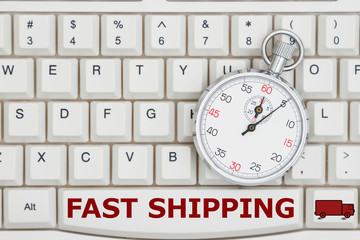 Stopwatch on a keyboard with text Fast Shipping and a truck