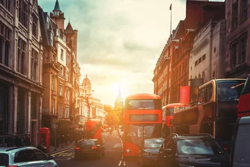 Tuinposter Oxford Street in London against golden sun ray while after work  © joeycheung