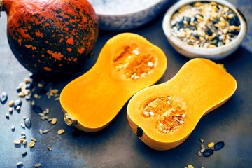 Pumpkin with different vegetables on the old wooden table top view ,Butternut