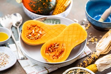 Pumpkin with different vegetables on the old wooden table top view ,Butternut