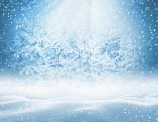 Winter background with snowdrifts for greeting card.  Christmas landscape with snowdrifts and pine branches in the frost.