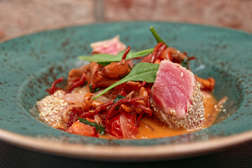 Dish with tuna, salami and mushrooms