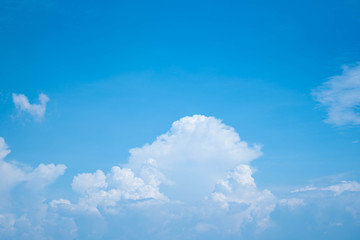 Naklejka na ściany i meble blue sky background is filled with white clouds
