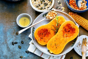 Pumpkin with different vegetables on the old wooden table top view ,Butternut