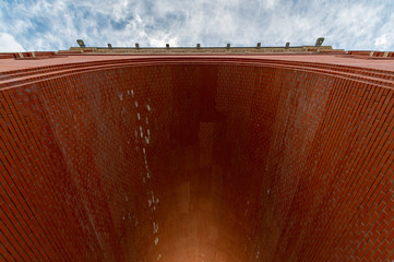 Arch of red brick. Sunlight at the end of tunnel. Symbol of hope, new life, search for goals and...