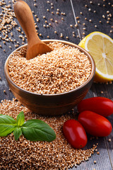 Bowl of amaranth grain on wooden table