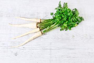 Parsley on wooden table.