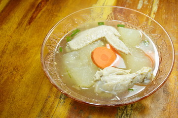boiled winter melon with chicken wing and leg hot soup on glass bowl