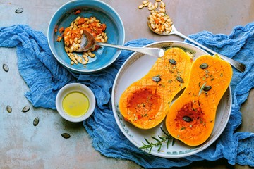Pumpkin with different vegetables on the old wooden table top view ,Butternut