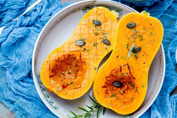 Pumpkin with different vegetables on the old wooden table top view ,Butternut