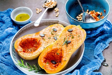 Pumpkin with different vegetables on the old wooden table top view ,Butternut