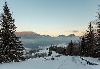 Fototapeta premium Sunrise winter Carpathian mountain village Zelene outskirts, Verkhovyna, Ukraine