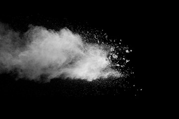 Explosion of white dust on black background. - 228710964