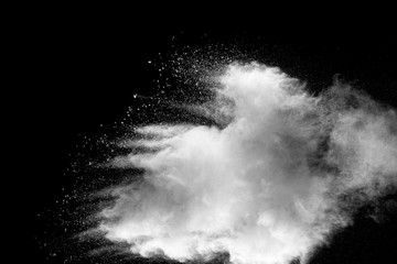 Explosion of white dust on black background.