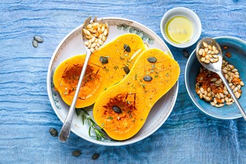 Pumpkin with different vegetables on the old wooden table top view ,Butternut