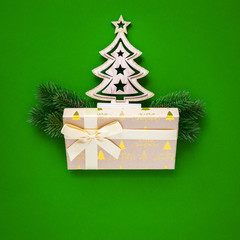 Christmas decoration green background with fir tree and gift box