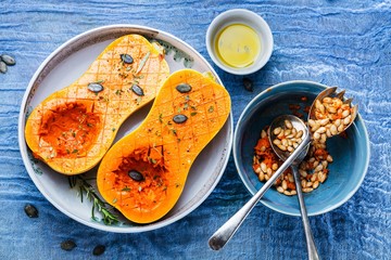 Pumpkin with different vegetables on the old wooden table top view ,Butternut