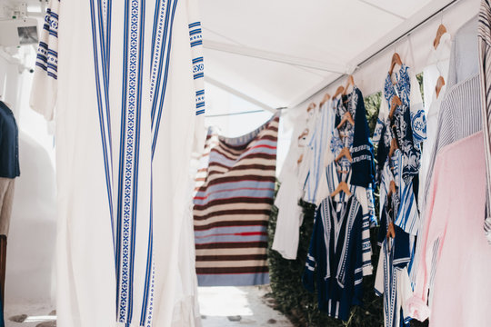 Different tunics on cloth hangers