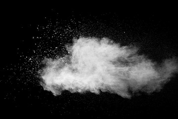 Explosion of white dust on black background.