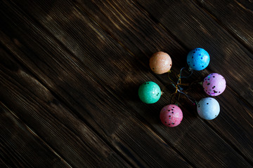 Christmas toys - multicolored Christmas balls on a dark natural background. Template for postcard