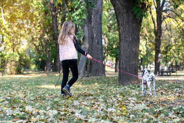 The girl with a dog in the park