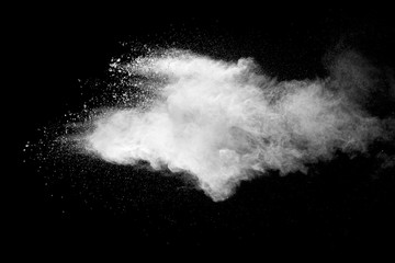 Explosion of white dust on black background.
