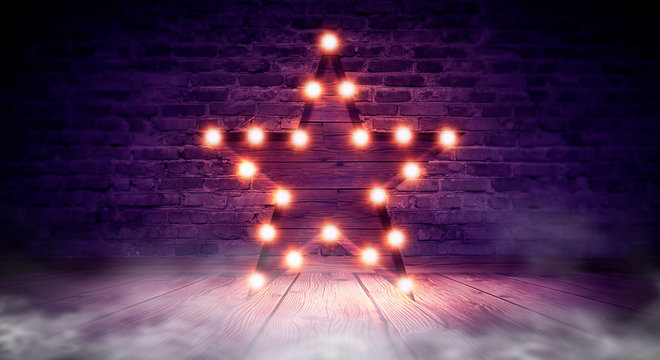 Star lamp on the background of an old brick wall, on the wooden floor, lights, lights, lights, glare, smoke. Exhibition star, light object, interior decor. Abstract dark background, night view, club 