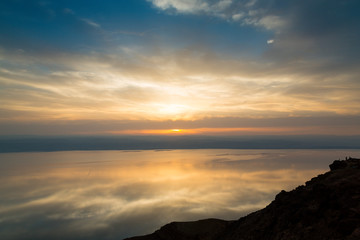 Dead Sea, Jordan. 6th June 2015. Dramatic skies reflect off the Dead Sea during sunset from a panoramic viewpoint near the town of Madaba.