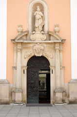 Fototapeta na wymiar Entrance portal of cathedral of Assumption in Varazdin, Croatia
