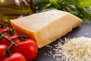 fragrant grated Parmesan on a slate stone slicing board